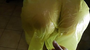 She empties the condom over her face after a blowjob wearing a rain poncho