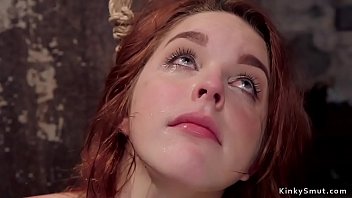 Redhead slave is whipped and fucked