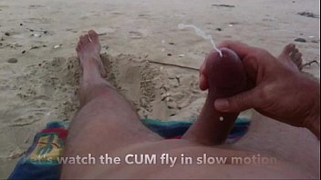 Curved cock wank and cum at nude beach